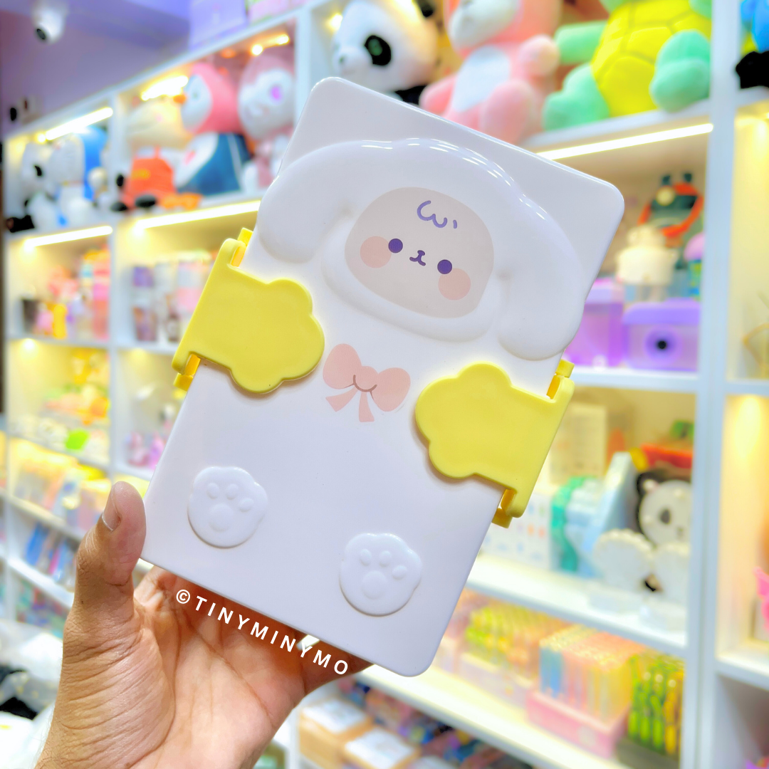 Yellow Adorable Sheep Snack Box held in front of a Colorful Toy Store Display - Tinyminymo