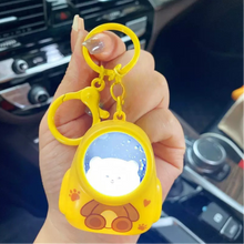 Load image into Gallery viewer, Yellow Color Astronaut Lightup Keychain Held by a Hand - Tinyminymo