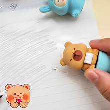Load image into Gallery viewer, Person using a Capybara Eraser on paper in the corner - Tinyminymo