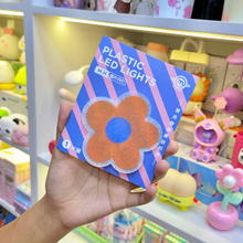 Load image into Gallery viewer, A Hand holding a Piece of Cute Flower Stick on Light in Orange Color - Tinyminymo