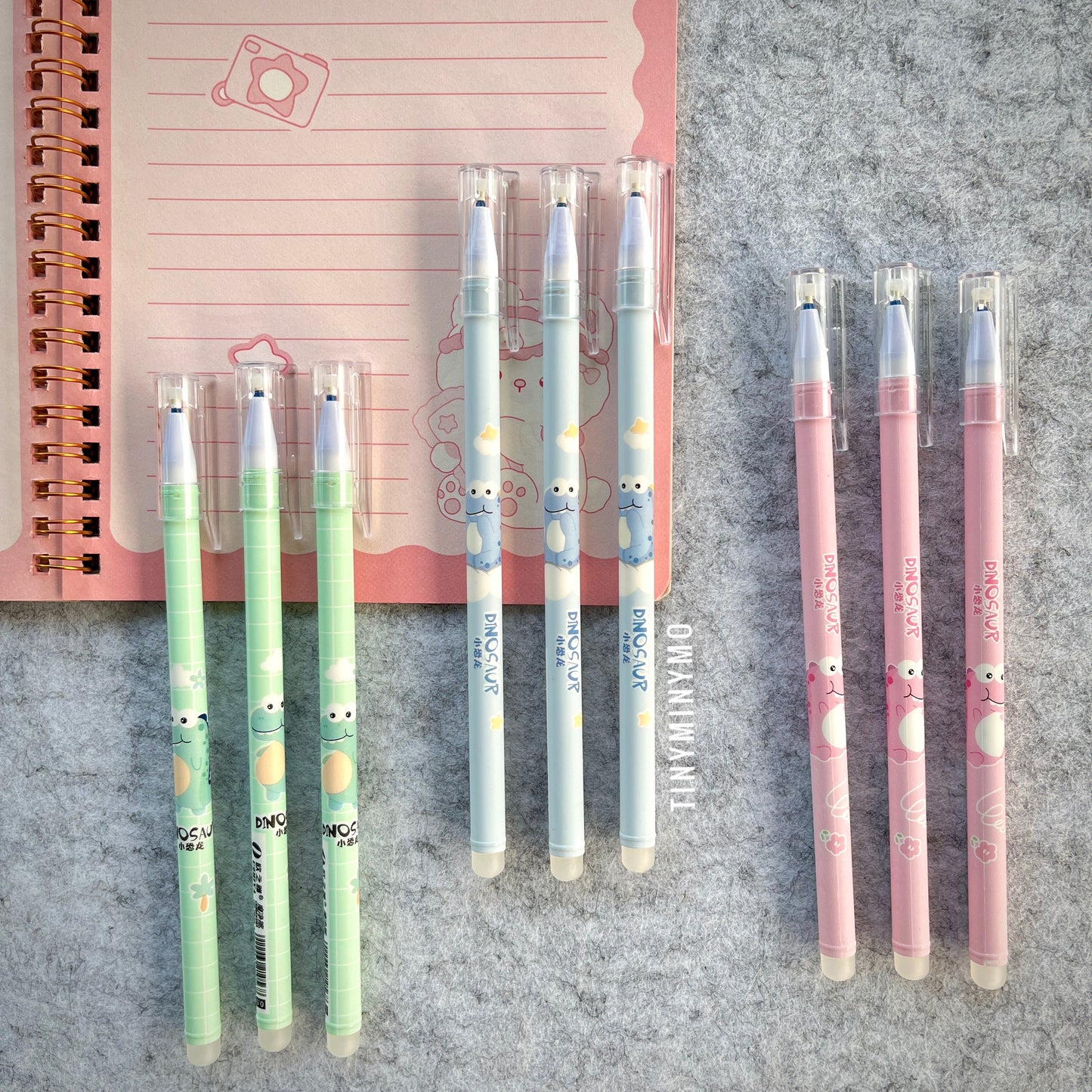 Set of Dinosaur-Themed Pens in 3 Colors on a Textured Surface - Tinyminymo