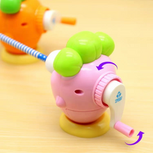 Load image into Gallery viewer, Pink Happy Carrot Mechanical Sharpener Sharpening the Pencil - Tinyminymo