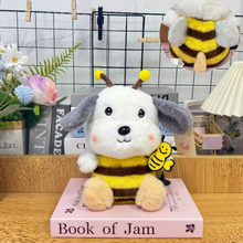 Load image into Gallery viewer, Honey Bee Cosplay Puppy Soft Toy Placed on a Book with Decorative Items and Books in the Background - Tinyminymo