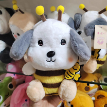 Load image into Gallery viewer, Honey Bee Cosplay Puppy Soft Toy Held in Hand in Front of Other Plush Toys - Tinyminymo