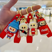 Load image into Gallery viewer, Four Coca-Cola Labubu Themed Keychains held by a hand - Tinyminymo