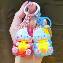 Load image into Gallery viewer, A Hand Holding Two Different Colored Lightup Cat Keychain with a Yellow Fish - Tinyminymo