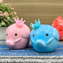 Load image into Gallery viewer, Pink and blue elephant-shaped figures with crowns on a textured surface - Tinyminymo