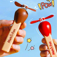 Load image into Gallery viewer, Two Match Stick Fans with Propellers, One Brown and one Red, Held by Hands Against Sky in Background with Cartoon Elements - TInyminymo