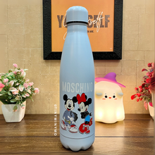 Load image into Gallery viewer, Light Blue Metallic Bottle with Mickey Mouse and Minnie Design Placed on a Wooden Surface Alongside Boo Night Light and Some Flowers - Tinyminymo