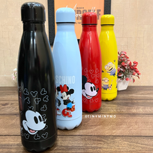 Load image into Gallery viewer, Four Colorful Metallic Bottles with Cartoon Character Designs Placed on a Wooden Surface - Tinyminymo