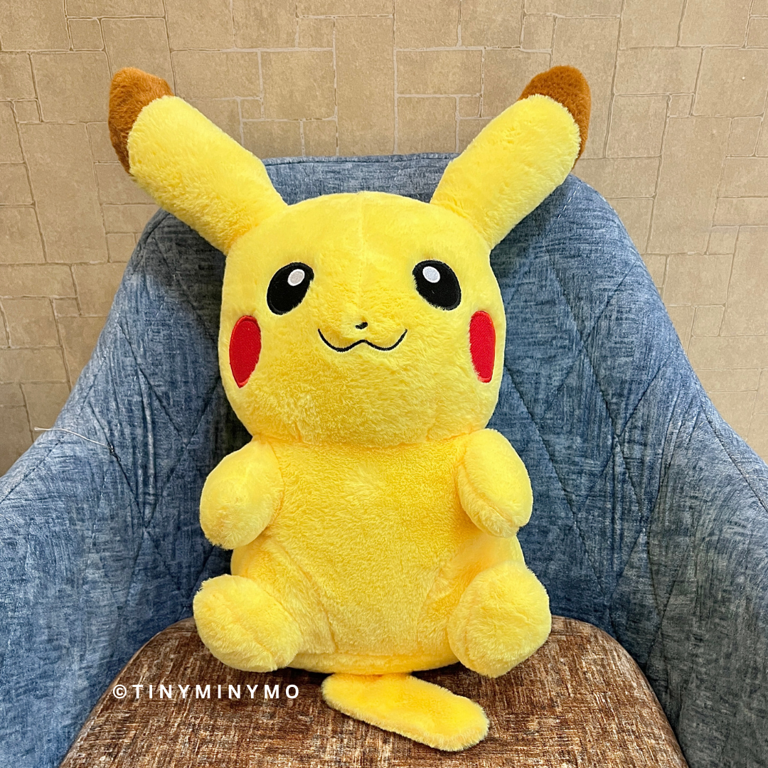 Pikachu Soft Toy on a denim chair and beige wall background - Tinyminymo