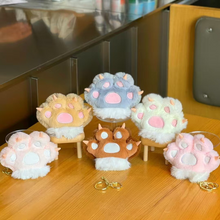 Load image into Gallery viewer, Plush Paw 3D Keychains in Various Colors Displayed on a Wooden Surface, a Cute and Cozy Collection - Tinyminymo