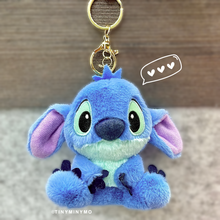 Load image into Gallery viewer, Blue Plush Stitch 3D Keychain with Brown Accents on a Wooden surface - Tinyminymo