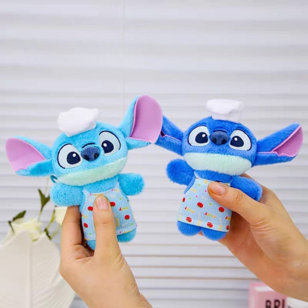 Two Blue Stitch Plush Keychains Held by Hand - Tinyminymo