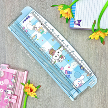 Load image into Gallery viewer, Sanrio Paper Trimmer - Cinnamoroll with Decorative Elements on a Wooden Surface - Tinyminymo