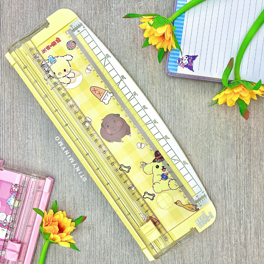 Sanrio Paper Trimmer - Pompompurin on a Wooden Surface with Flowers and Stationery Items - Tinyminymo