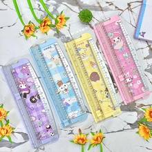 Load image into Gallery viewer, Set of Colorful Sanrio Paper Trimmers on a Textured Surface with Flowers Around - Tinyminymo