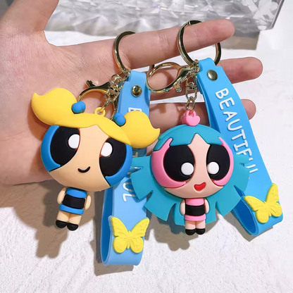 Two 3D Powerpuff Girls Keychain Held in a Hand against a White Background - Tinyminymo