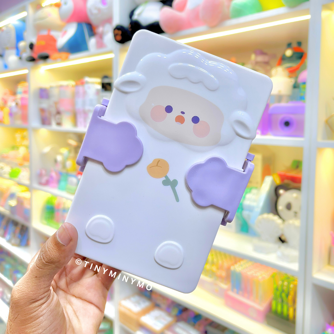 Lilac Adorable Sheep Snack Box held in front of a Colorful Store Display - Tinyminymo