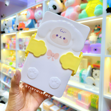 Load image into Gallery viewer, Yellow Adorable Sheep Snack Box held in front of a Colorful Toy Store Display - Tinyminymo
