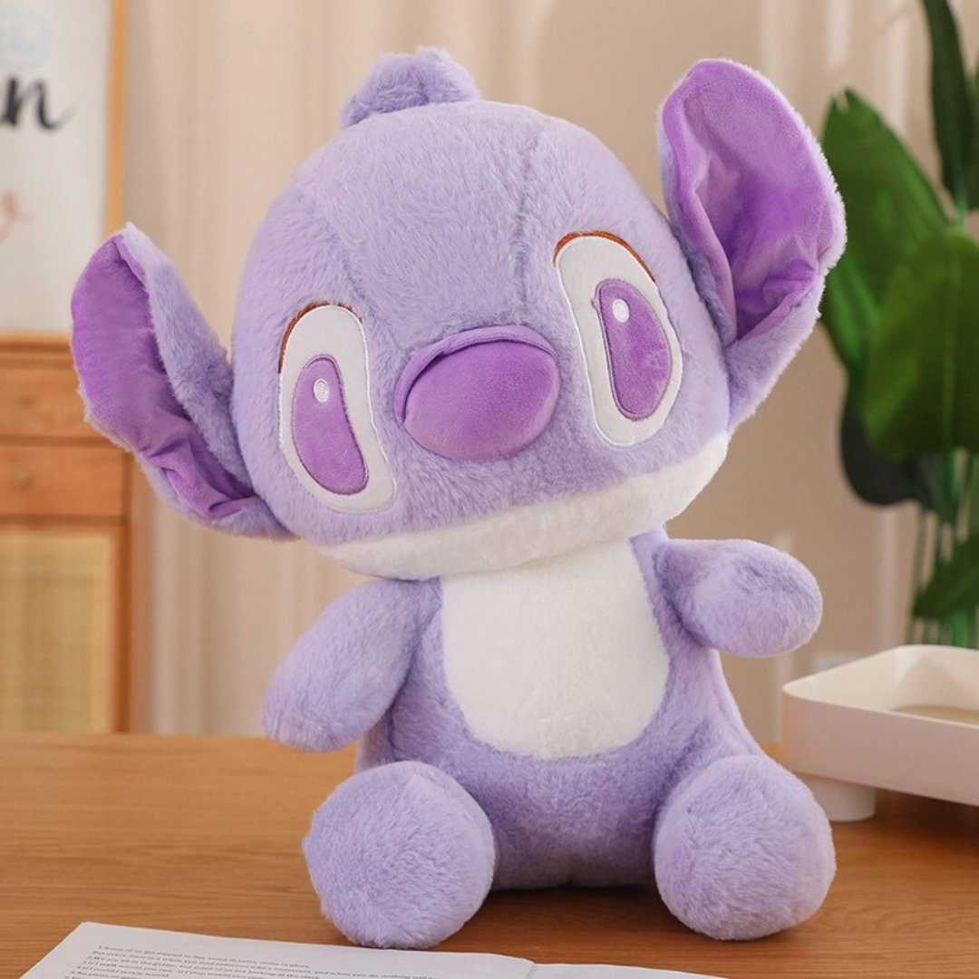 Tilted Head of Adorable Plush Toy with Large Ears Sitting on the Table - Tinyminymoe