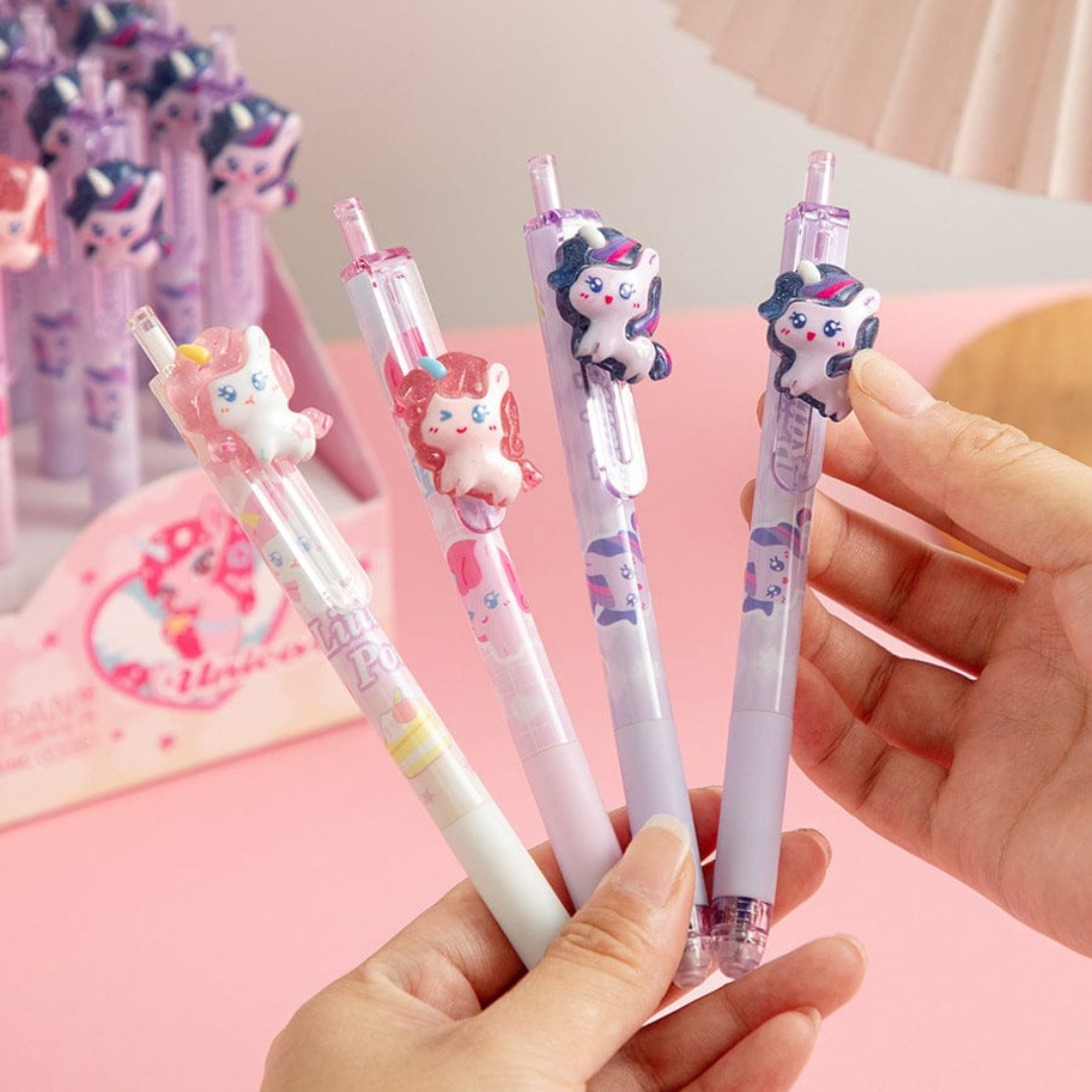 Adorable Unicorn Pen Held by a Hand with a Pink Background - Tinyminymo