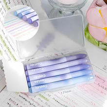 Load image into Gallery viewer, Set of Purple and Blue Aesthetic Highlighters in a Clear Case Placed on a Desk with a Flower Pen Holder - Tinyminymo
