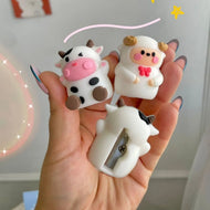 Hand Holding Two Animal Pencil Sharpeners - Tinyminymo