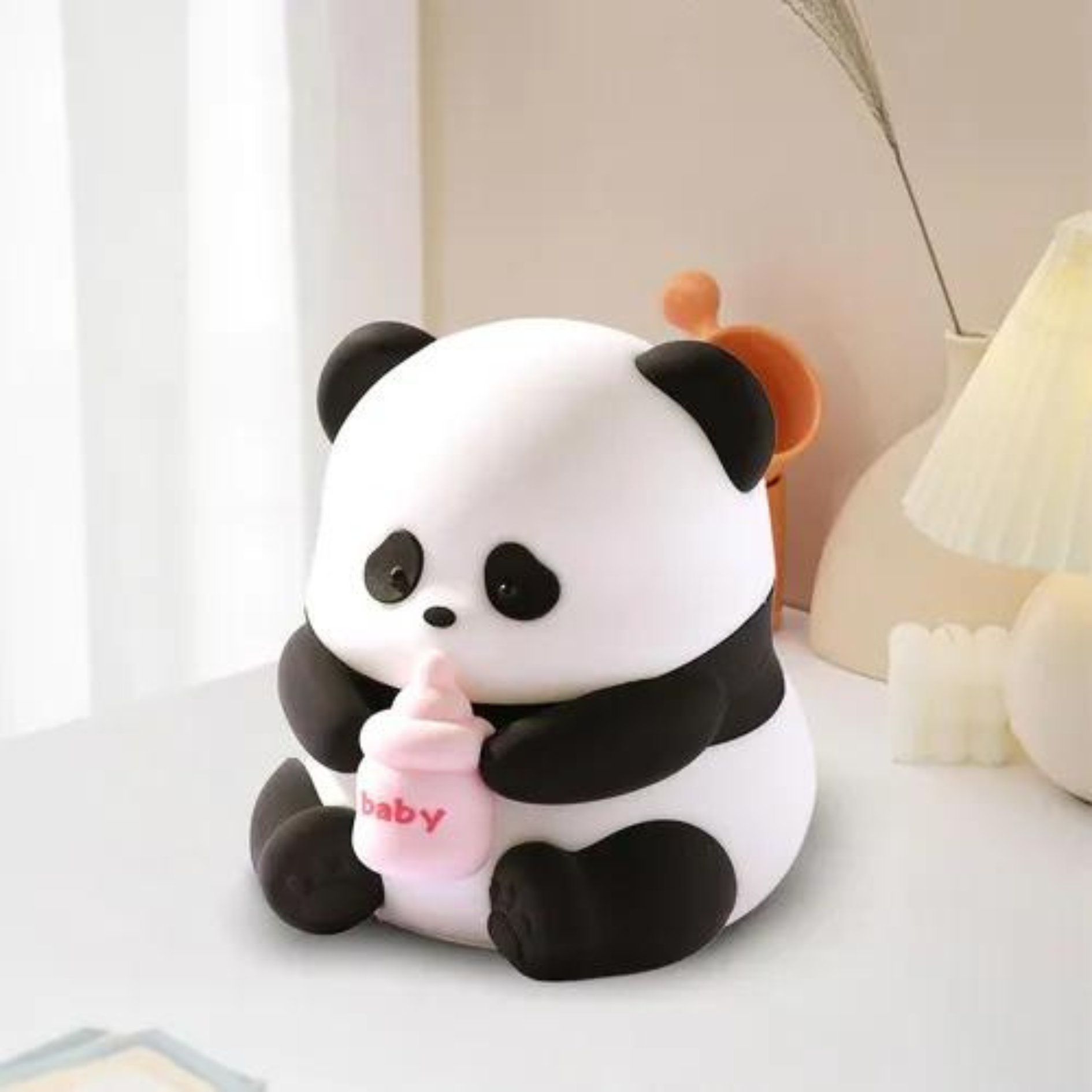 Baby Panda Silicone Night Light on a Light Surface - Tinyminymo