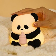 Load image into Gallery viewer, Baby Panda Silicone Night Light Held by a Hand on a Soft Surface - Tinyminymo
