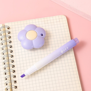 Purple Flower Shaped Paper Cutter and Highlighter Kept on a Notebook - Tinyminymo