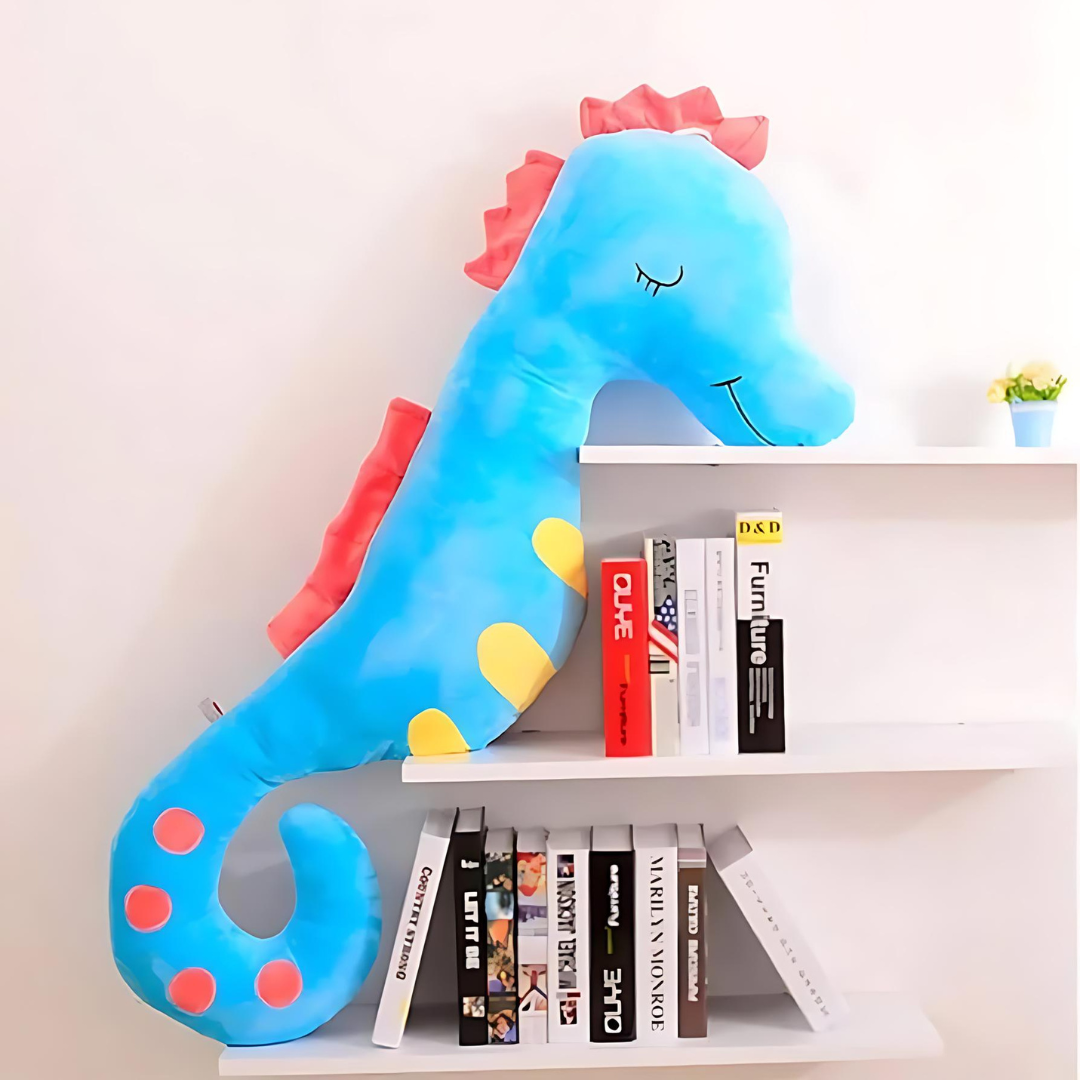 Blue Plush Seahorse Toy on a shelf with books - Tinyminymo