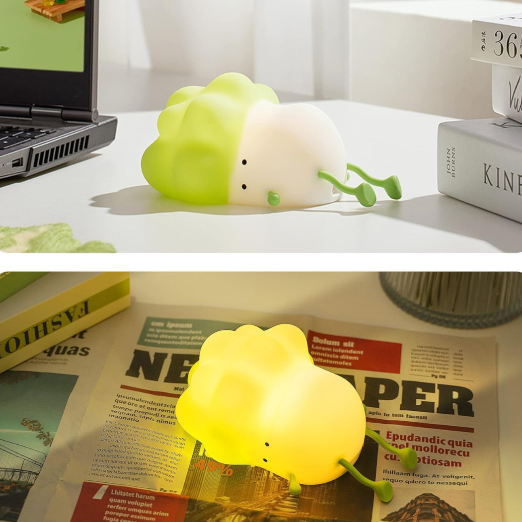 Cabbage Silicone Night Light Placed on a Desk with LIghts off and Another One Next on the News Paper with Lights on - Tinyminymo