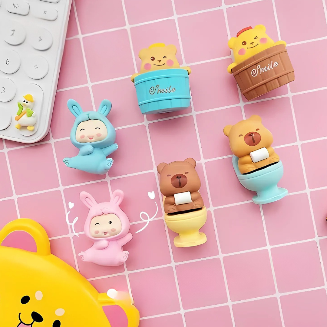 Set of Capybara Erasers on a pink grid background - Tinyminymo