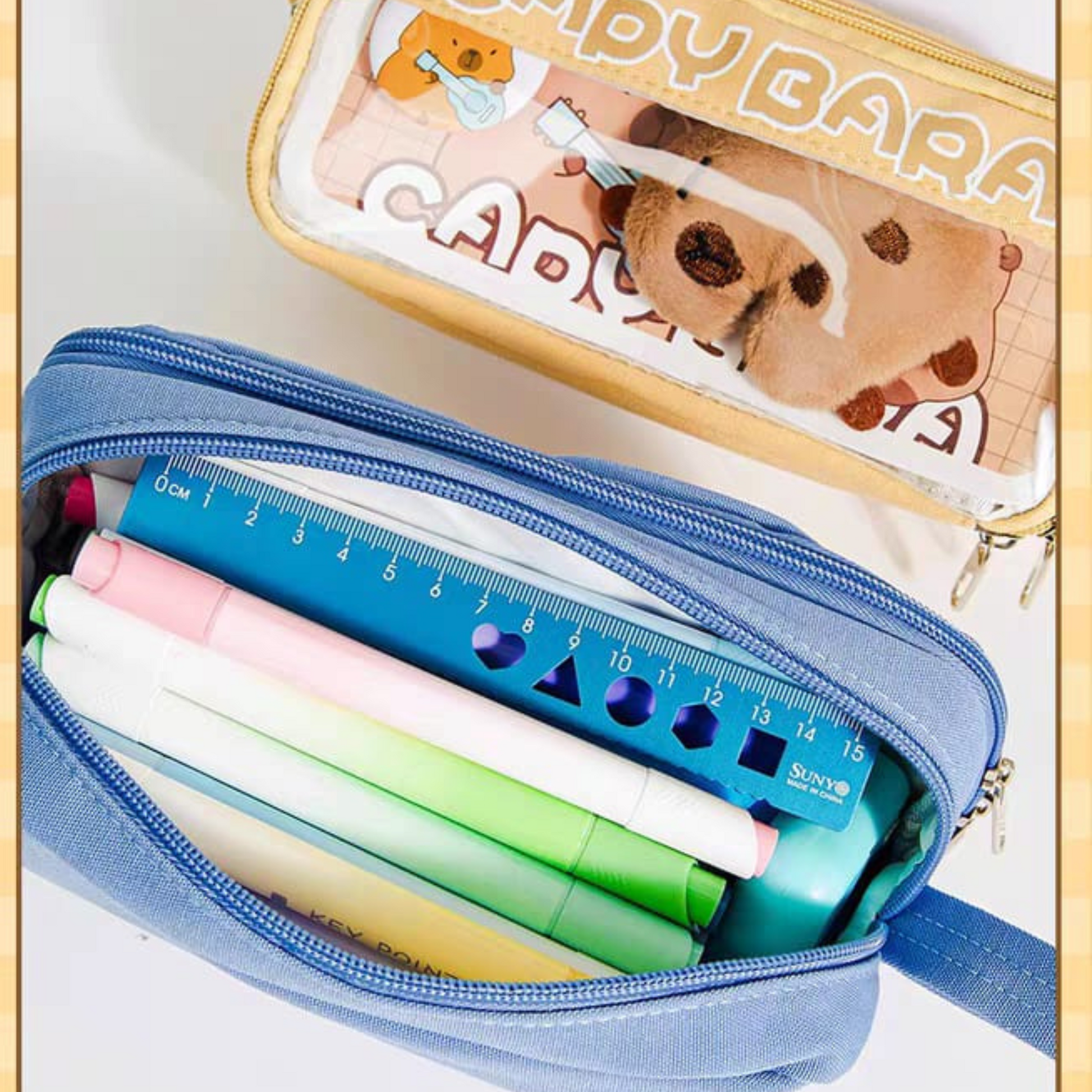 Pencil case with stationery items and a ruler kept inside the Pouch - Tinyminymo