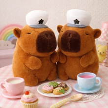 Load image into Gallery viewer, Capybara Plushie wearing a White Cap - Tinyminymo

