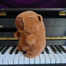 Load image into Gallery viewer, Capybara Plushie Sitting on a Piano - Tinyminymo
