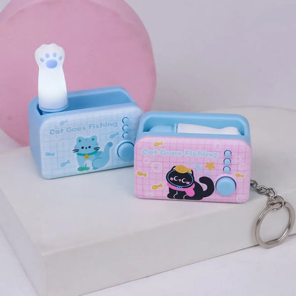 Two Cat Claw Light Keychains with Light on and closed both - Tinyminymo