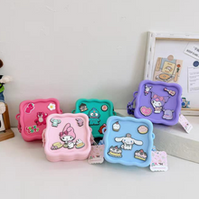 Load image into Gallery viewer, Set of Colorful Character Silicone Bags with Sanrio Designs on a White Surface - Tinyminymo
