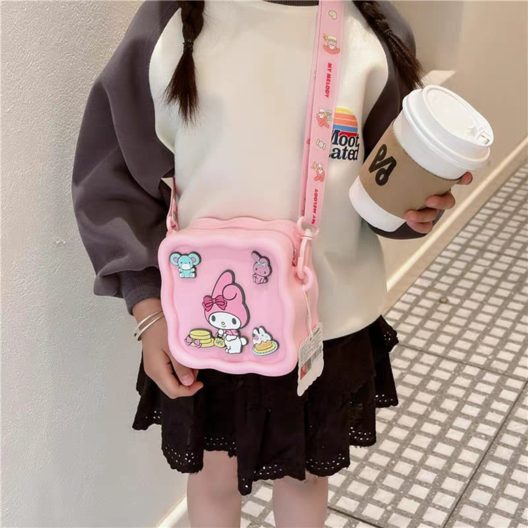 Person Holding a Pink My Melody Silicone Sling Bag and a Coffee Cup - Tinyminymo
