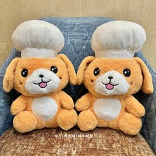 Load image into Gallery viewer, Two Chef Puppy Soft Toy on a a Blue and Brown Cushioned Chair - Tinyminymo
