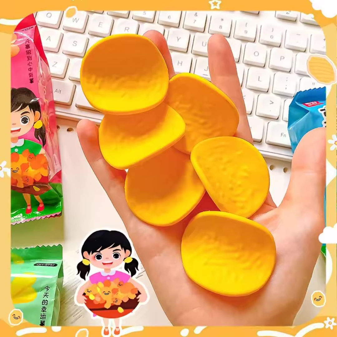 Hand holding Chips Erasers and a keyboard in the background - Tinyminymo
