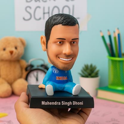Bobblehead of Mahendra Singh Dhoni held by a Hand in a Blue Jersey - Tinyminymo