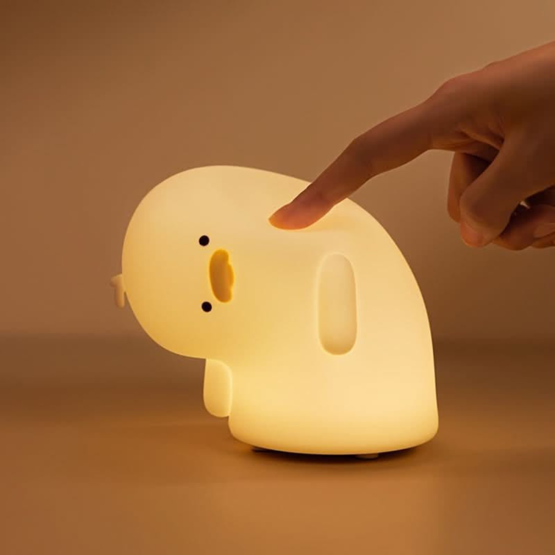 Crooked Neck Duck Silicone Night Light Glowing Brightly as It's Touched by a Finger on a Plain Surface - Tinyminymo