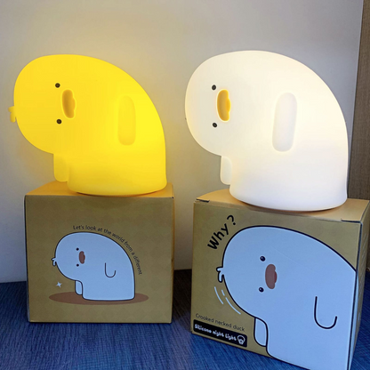 Two Crooked Neck Duck Silicone Night Lights Placed on Box, One Glowing White, the Other Emitting a Soft Yellow Light - Tinyminymo