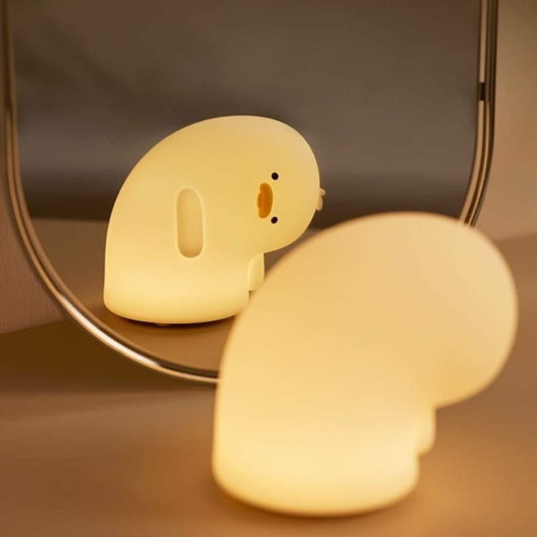 Crooked Neck Duck Silicone Night Light Placed in Front of a Mirror, Emitting a Warm, Cozy Glow - Tinyminymo