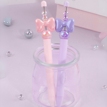 Load image into Gallery viewer, Pink and Purple Crystal Bowknot Gel Pen in a Transparent Pen Holder - Tinyminymo
