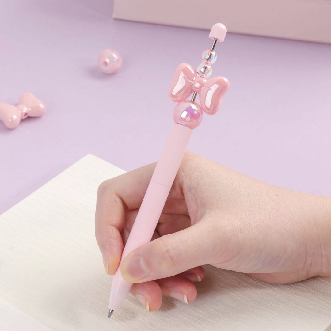 Pink Crystal Bowknot Gel Pen being Used for Writing - Tinyminymo