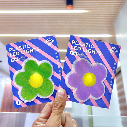 Two pieces of Cute Flower Stick on Light held by a hand - Tinyminymo