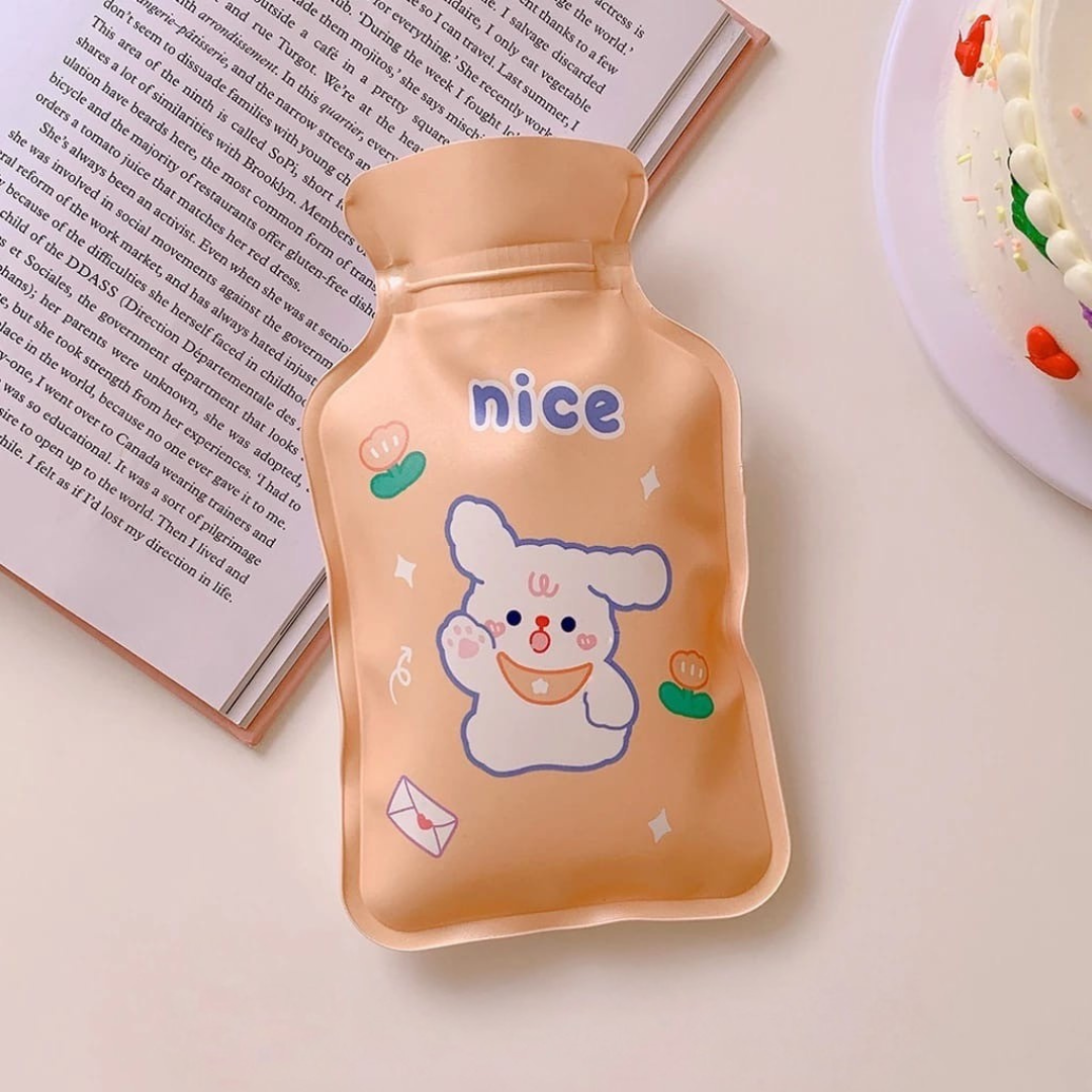 Peach Cute Hot Water Bag with cartoon character and 'nice' text on a light surface - Tinyminymo